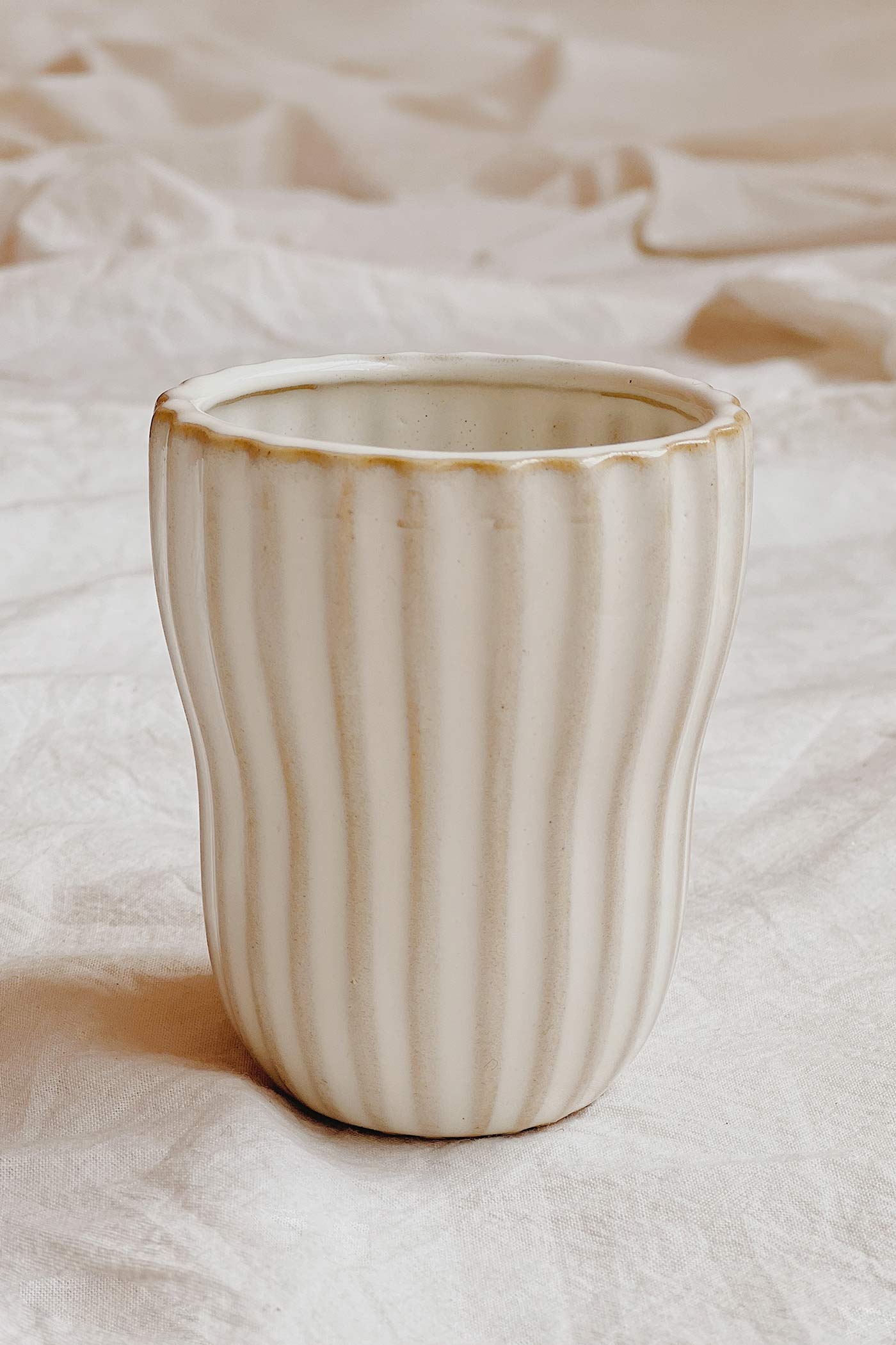 lifestyle shot of view of Alsleben Small Ribbed Ceramic Cup at Maison garçonne