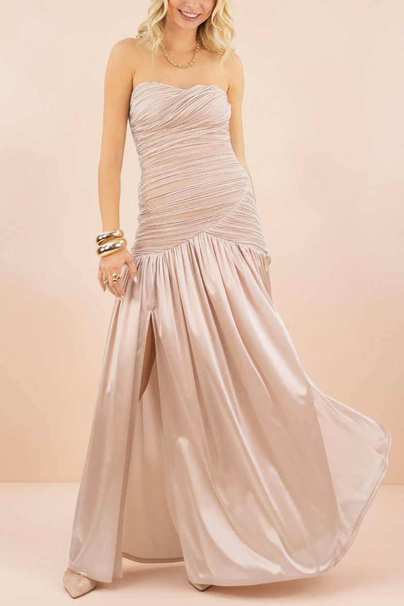 a woman wearing Islana Champagne Strapless Pleated Maxi Dress from Boutique 1861