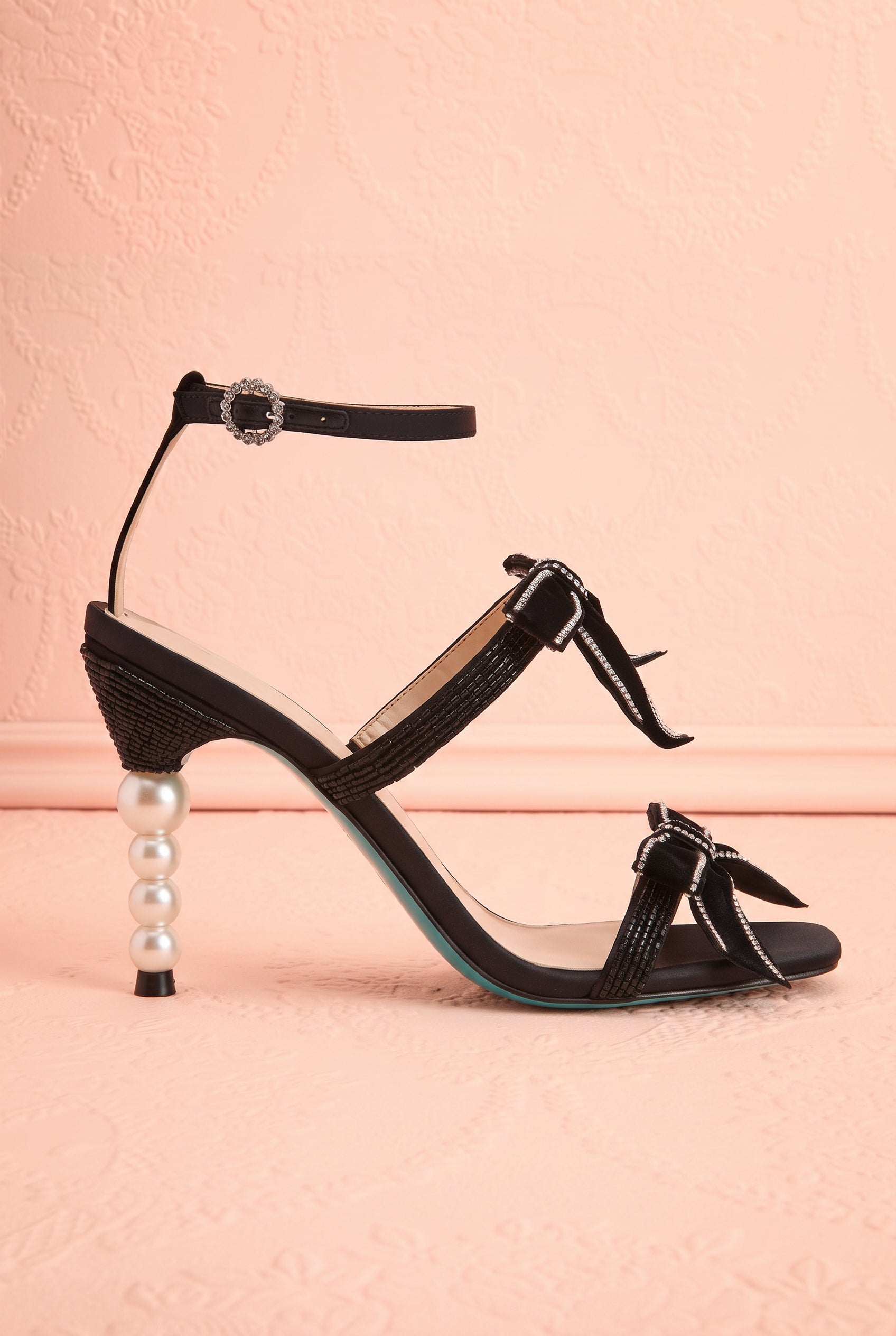 Side view of Jerusa Black Sparkling High-Heel Sandals with Bows at boutique 1861