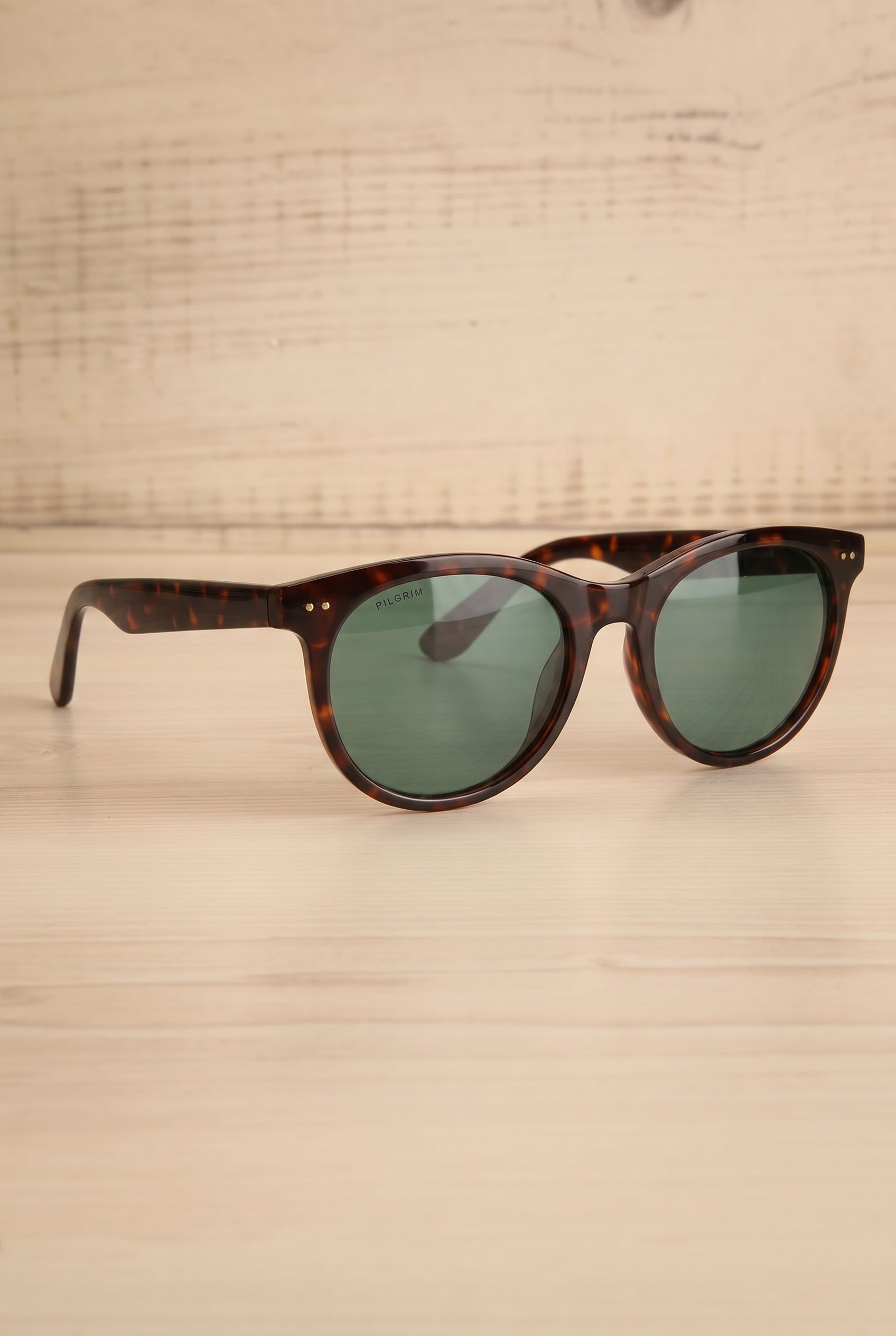 Profile of Jelena Brown Tortoise Shell Circular Sunglasses by Pilgrim at la petite garçonne