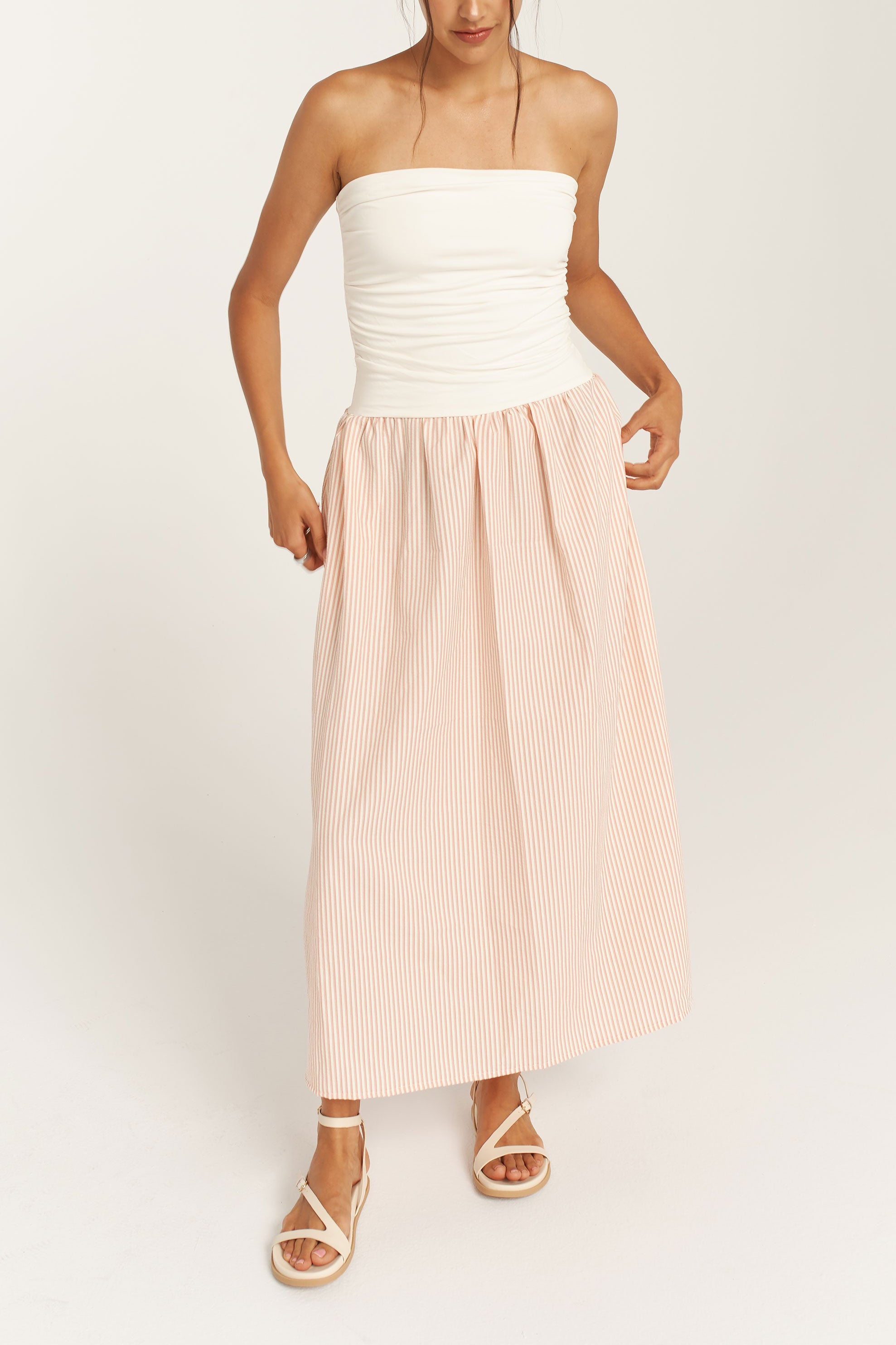 woman wearing Julya Pink  Pinstripe Strapless Maxi Dress with Pockets by Dailystory from la petite garçonne
