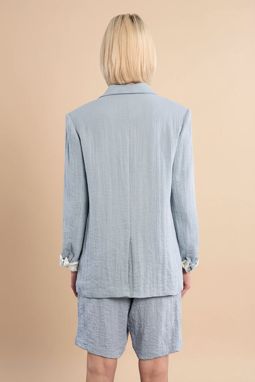Backview of a Woman wearing Kandla Oversized Light Blue Blazer from la petite garçonne