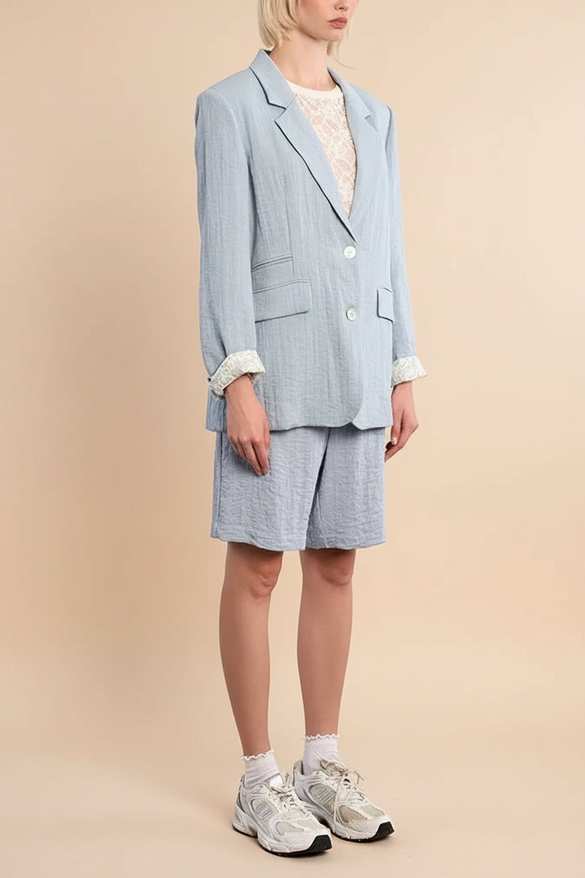 Sideview of a Woman wearing Kandla Oversized Light Blue Blazer from la petite garçonne