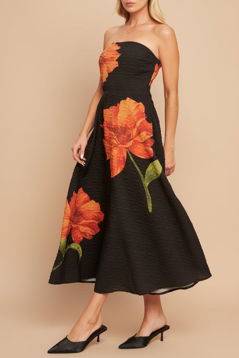 Side view of a Woman wearing the Kerina Midi Floral Strapless Dress from boutique 1861