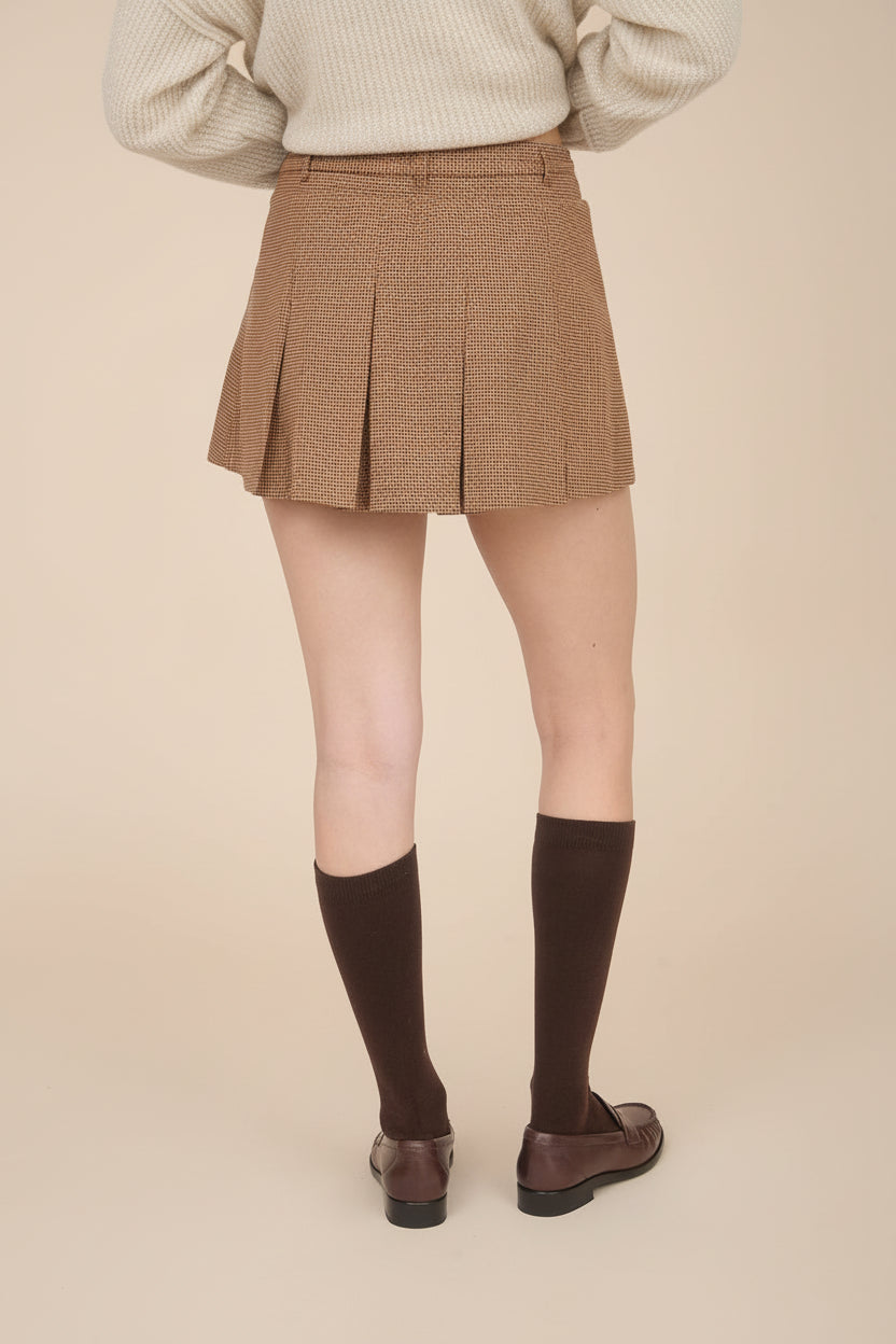 back of a woman wearing Kohima Brown Houndstooth Mini Skirt with Built in Shorts from La petite garçonne
