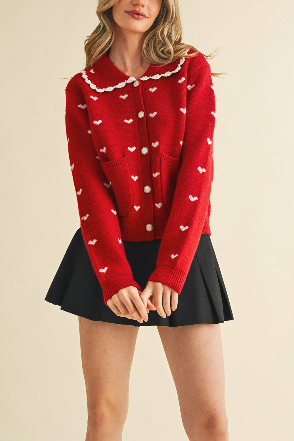 front view of a woman wearing Kristeen Red Knit Cardigan with Heart Pattern from Boutique 1861