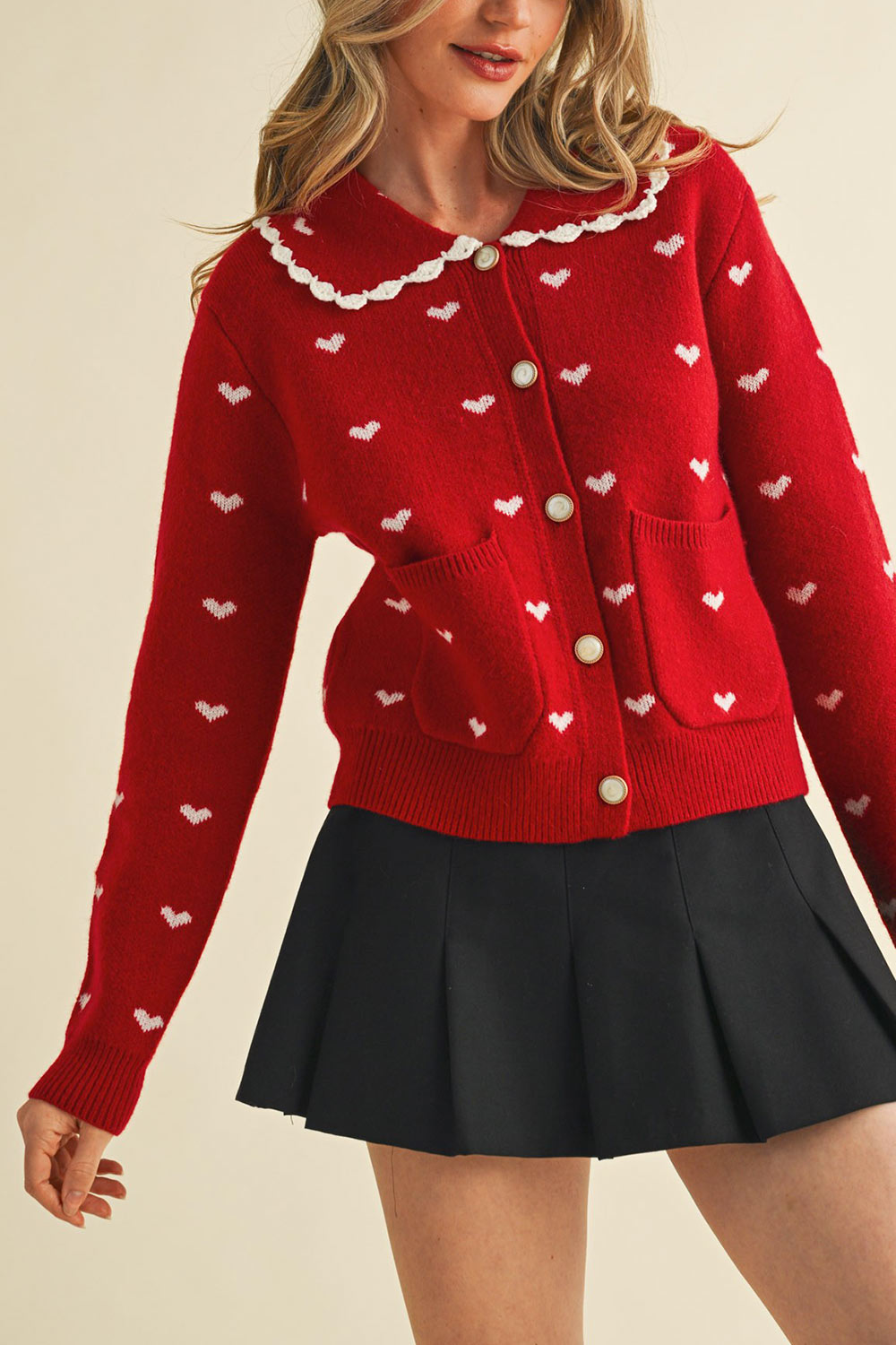 view of a woman wearing Kristeen Red Knit Cardigan with Heart Pattern from Boutique 1861