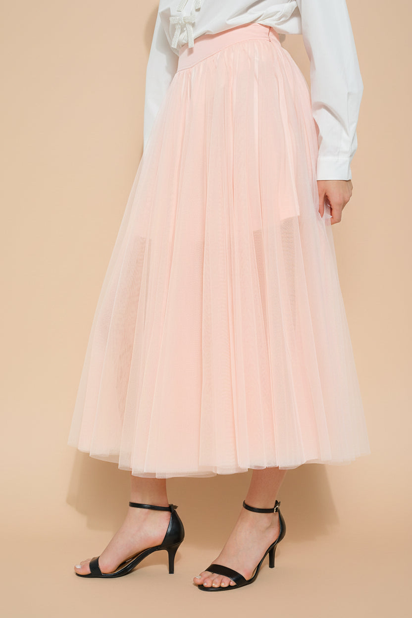 side close-up of a woman wearing Laurelia Blush Low Rise Tulle Maxi Skirt from Boutique 1861