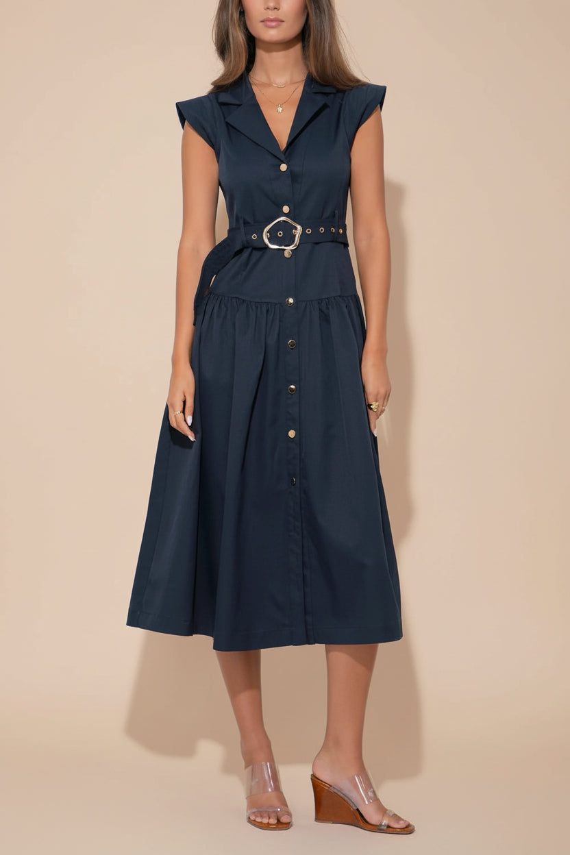 a woman wearing Lauretta Navy A-Line Midi Dress with Gold Button Detail and Belt from La petite garçonne