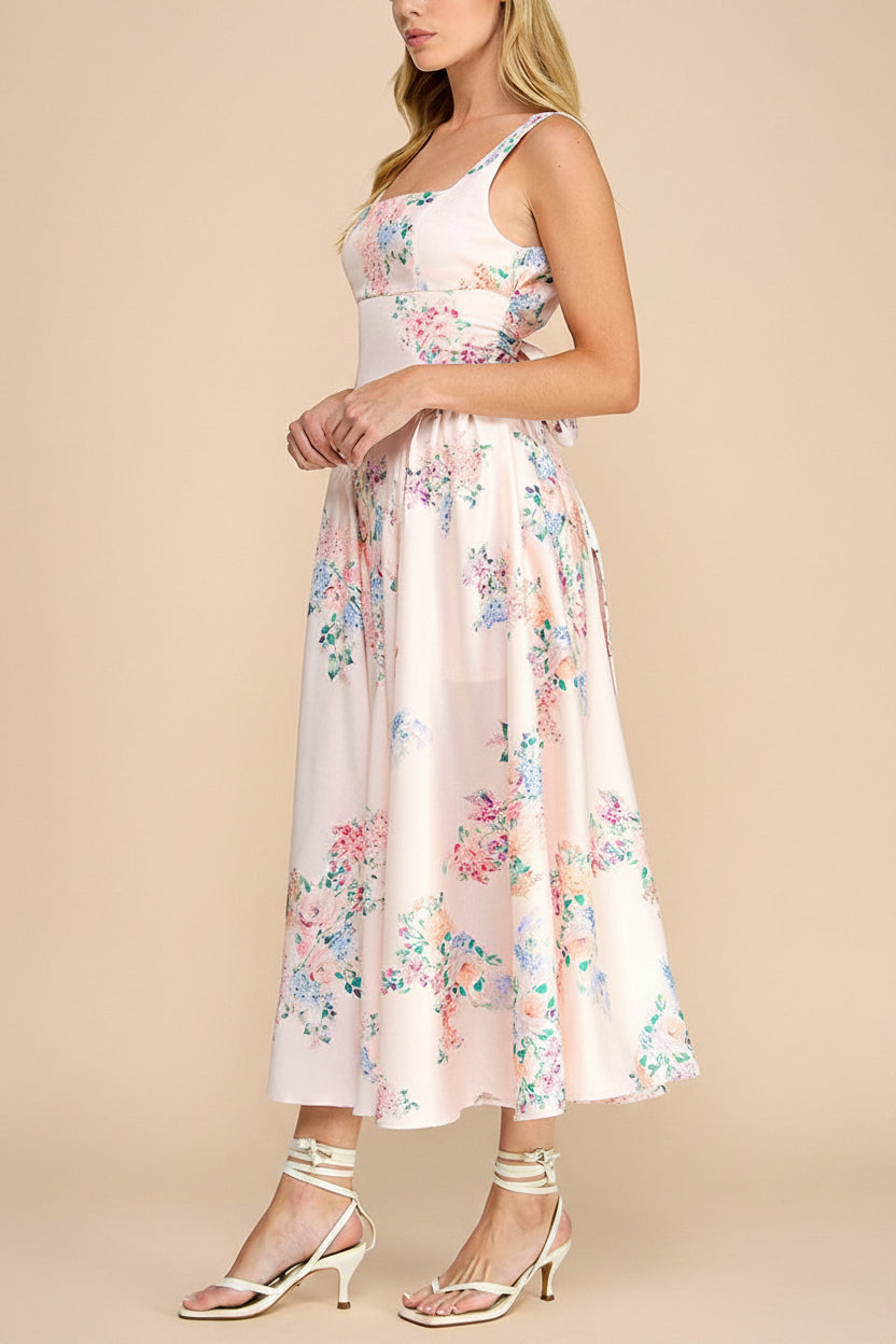 side  view of a woman wearing Leah A-Line Midi Pink Floral Dress with Ribbons at Back from Boutique 1861