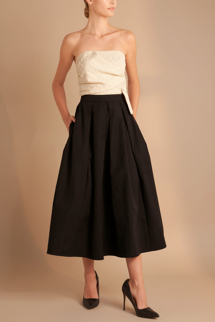 front view of a woman wearing Lindsay Midi Strapless Dress with Draped Bodice from Boutique 1861