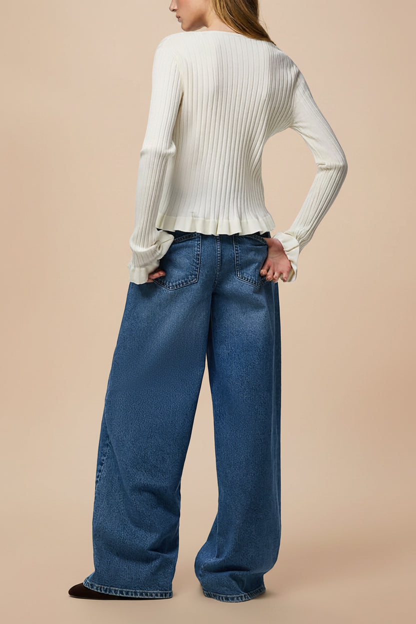 back of a woman wearing Lortona Ivory Ribbed Knit Cardigan with Front Tie and Frill Details from La petite garçonne