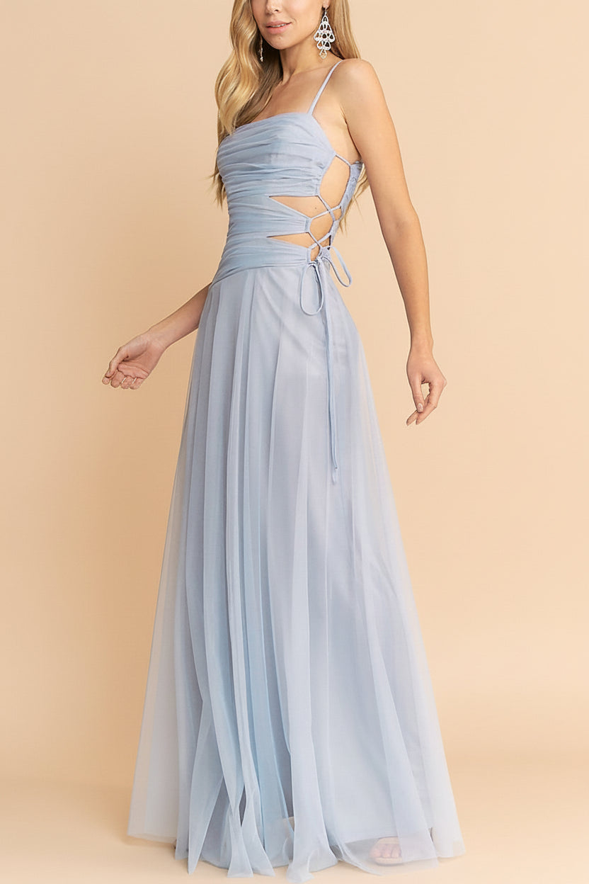 side of a woman wearing Micah Light Blue Tulle Maxi Dress with Ruched Bodice and Side Cutouts from Boutique 1861
