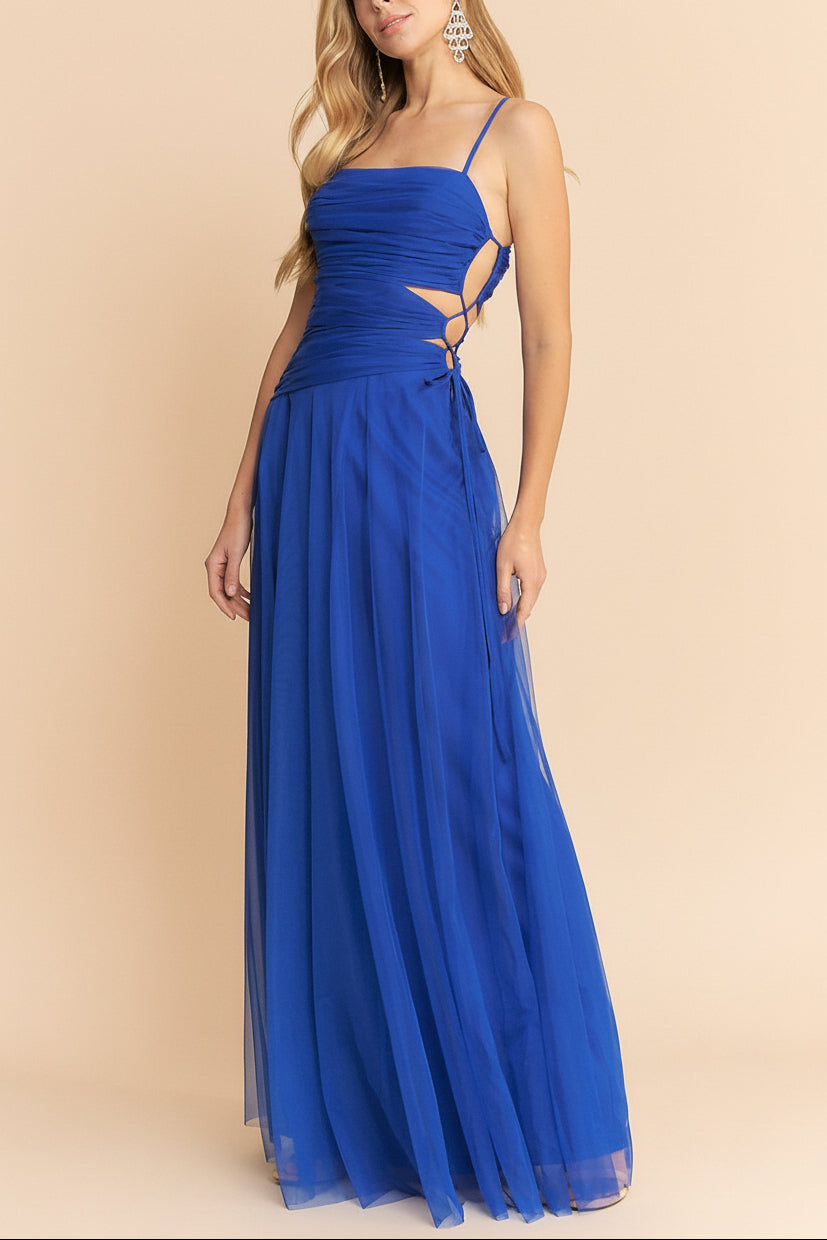 side of a woman wearing Micah Blue Tulle Maxi Dress with Ruched Bodice and Side Cutouts from Boutique 1861