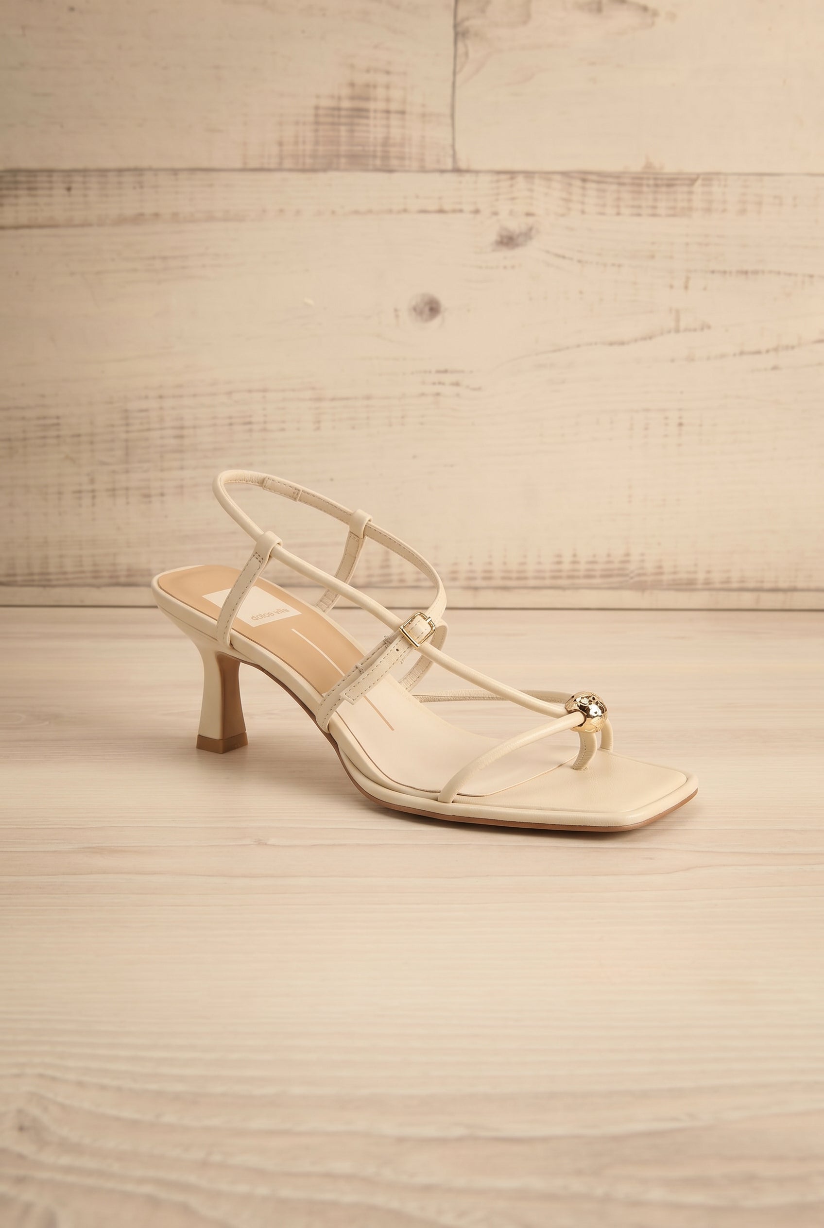 Front Mylee Ivory Strappy Leather Sandals with Sculptural Heel by Dolce Vita at la petite garçonne