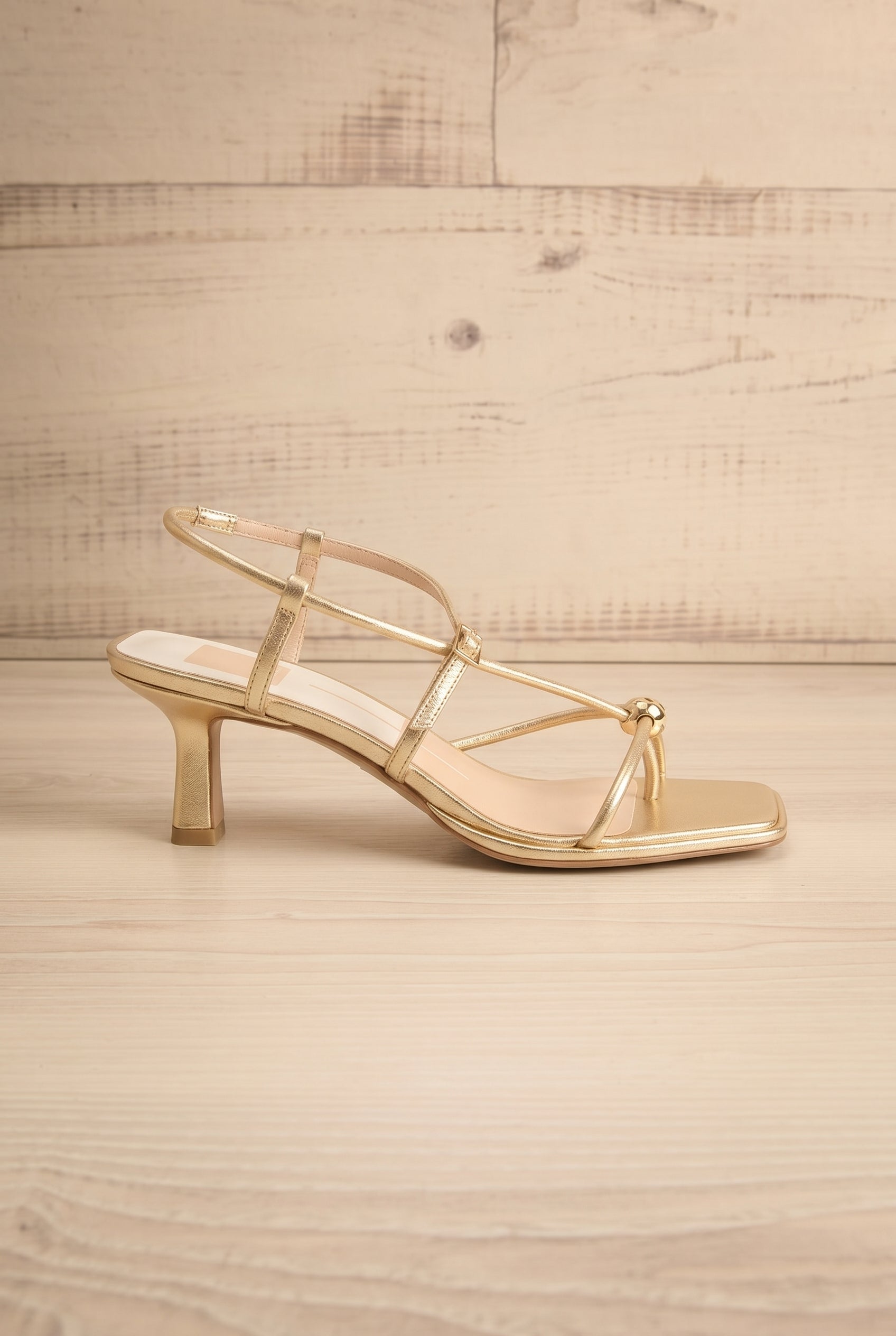 Sideview Mylee gold Strappy Leather Sandals with Sculptural Heel by Dolce Vita at la petite garçonne