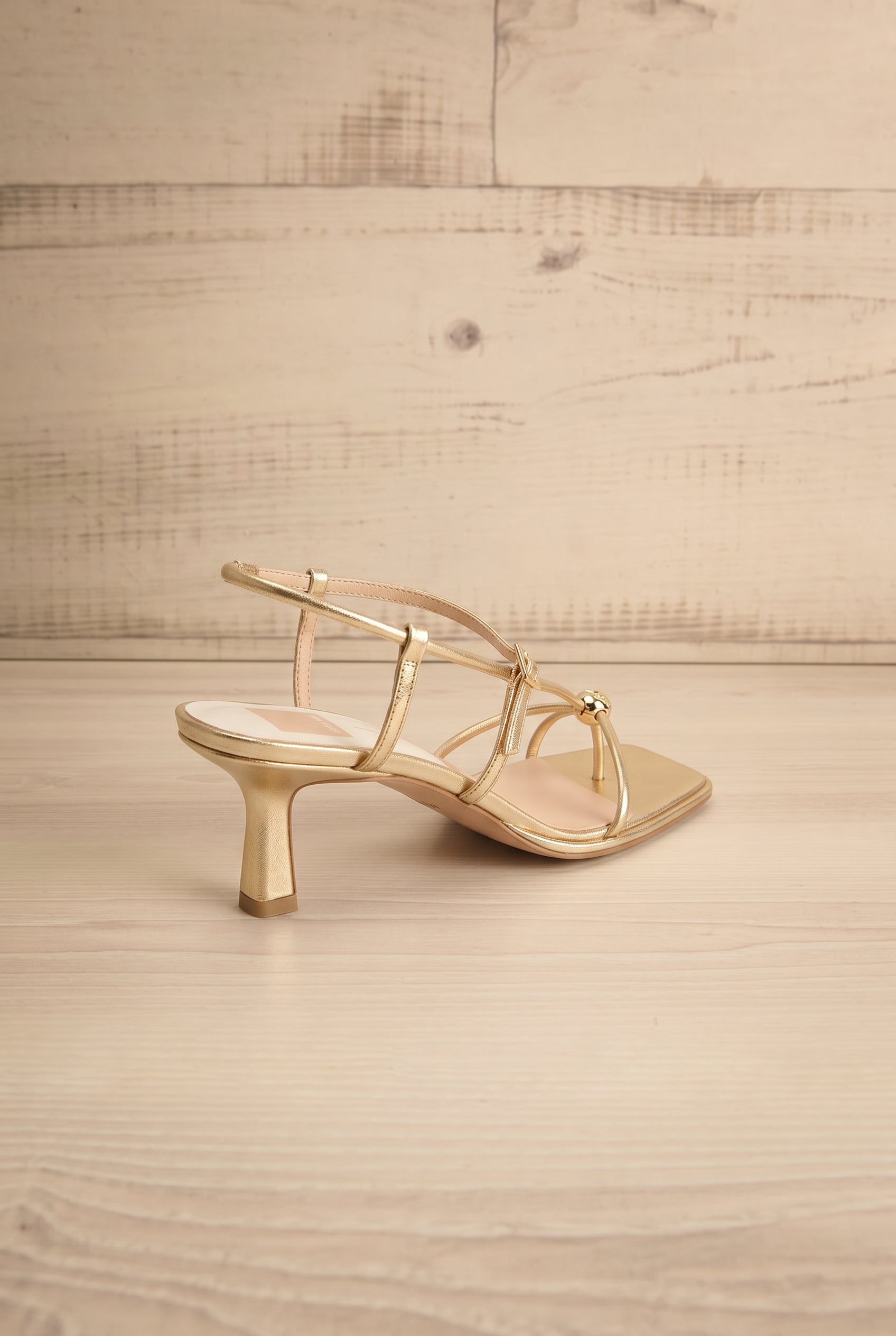 Backview Mylee gold Strappy Leather Sandals with Sculptural Heel by Dolce Vita at la petite garçonne