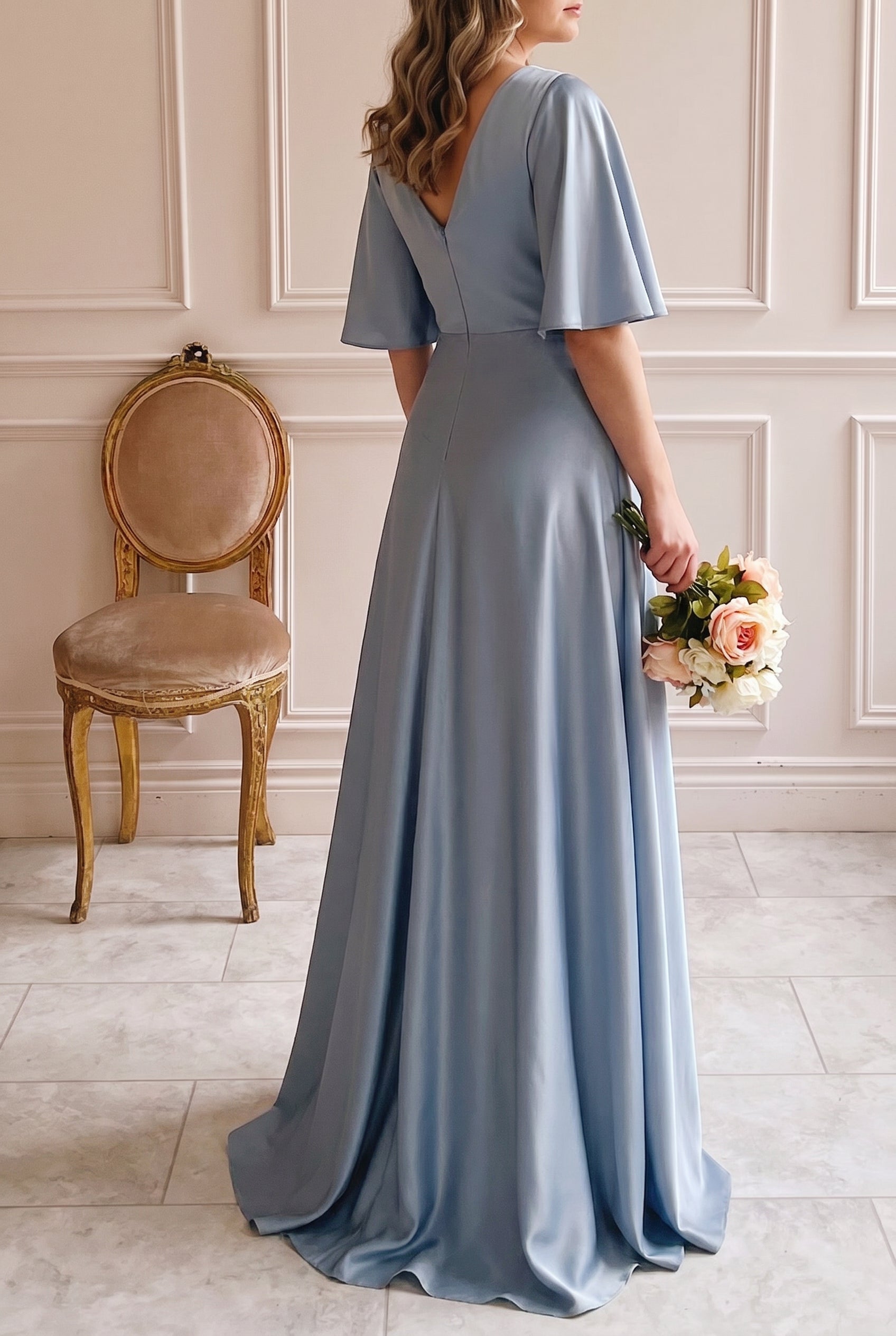 Backview woman wearing Marinella Blue Satin Maxi Dress with Bell Sleeves at boutique 1861