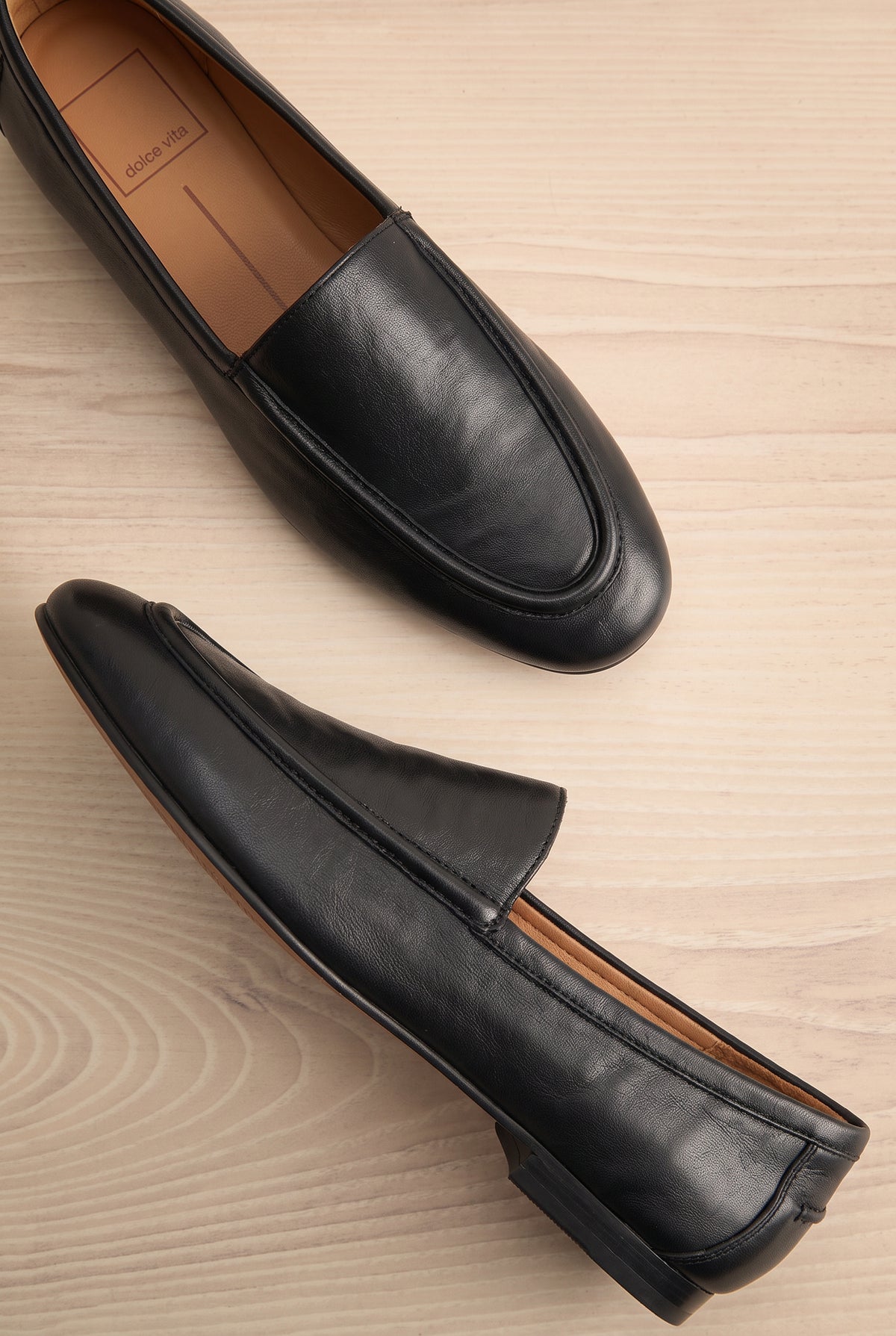 flat lay of Matty Black Leather Round Toe Loafer Shoes at La petite garçonne
