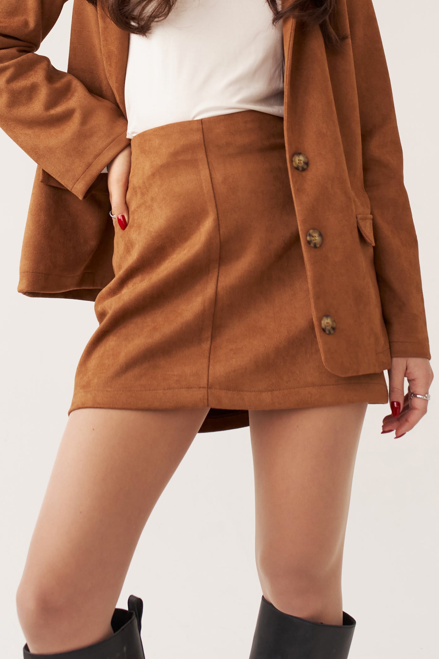 close-up of a woman wearing Miley Skirt Caramel Faux Suede Short Skirt by Dailystory from La petite garçonne 