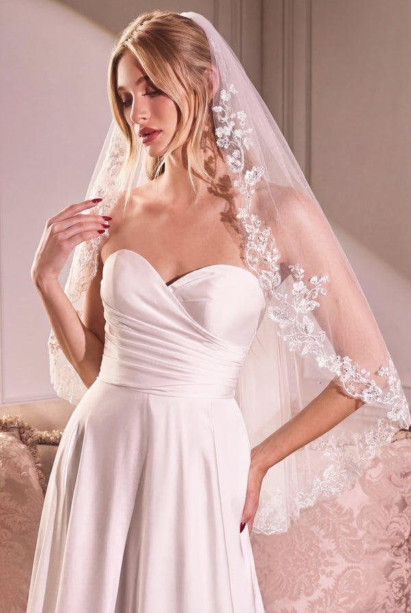 Woman wearing the Mirelisse White Tulle Wedding Veil with Floral Appliqués from Boudoir 1861 