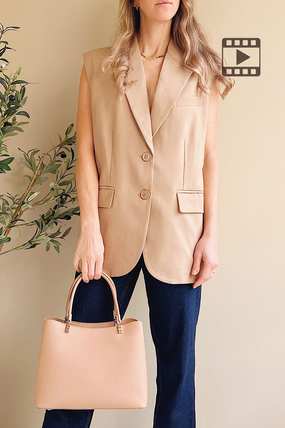 Woman wearing Myret Long Sleeveless Beige Blazer from La petite garçonne 