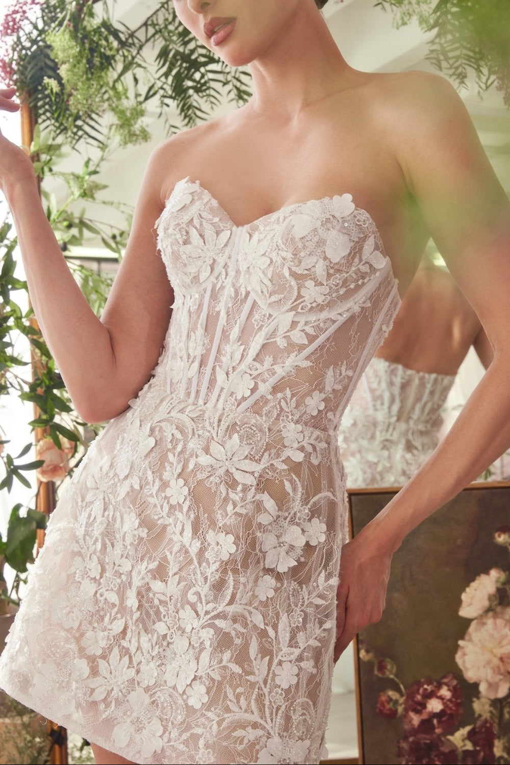 Close-up of a Woman wearing the Nalah White Short Corset Dress with Appliqués available at Boudoir 1861