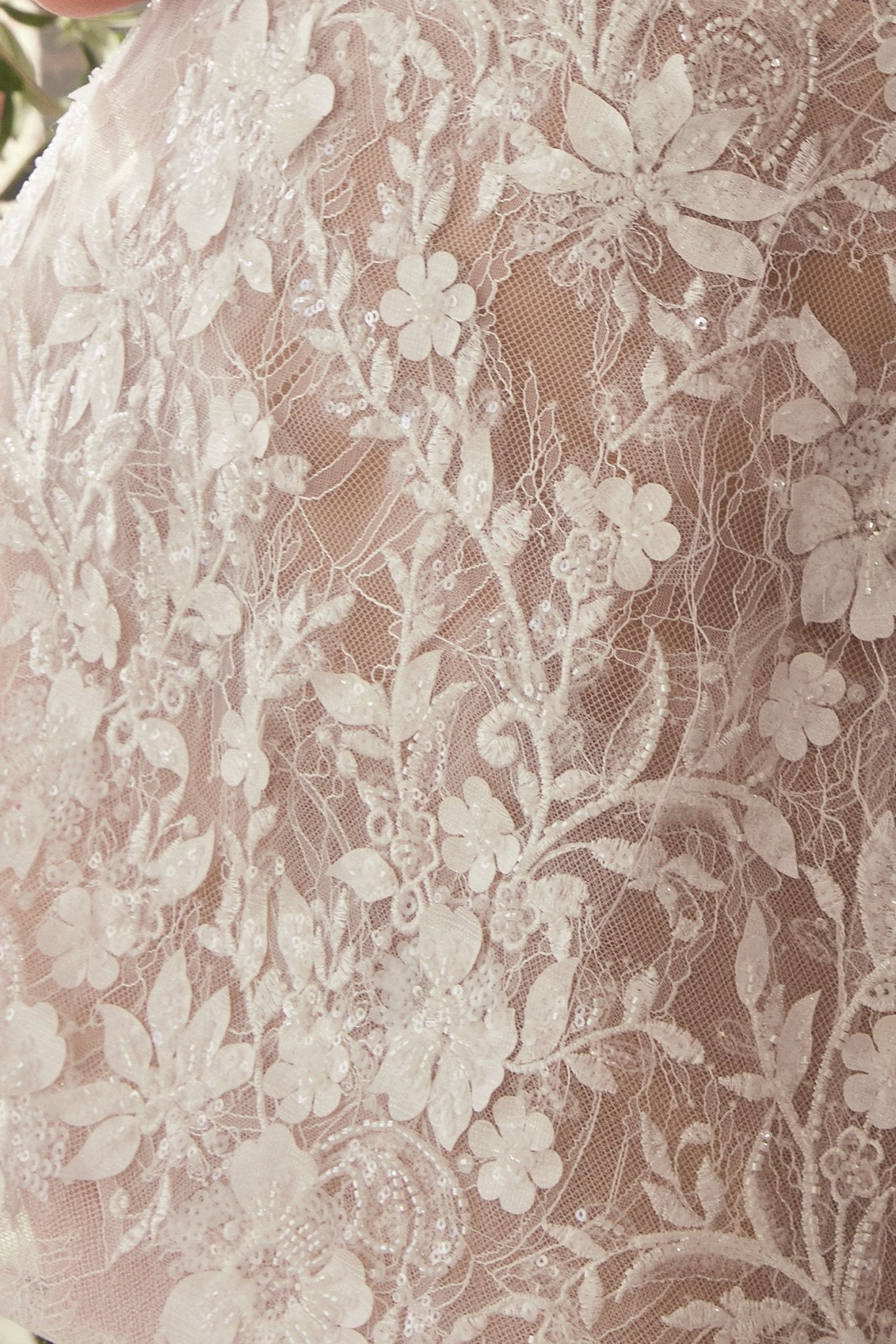 Close-up the Nalah White Short Corset Dress with Appliqués available at boutique 1861