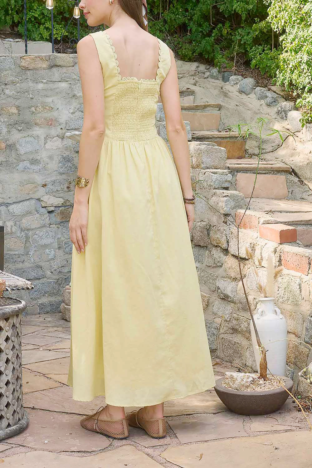back view of a woman wearing Nena Yellow Long Dress with Square Neckline from Boutique 1861