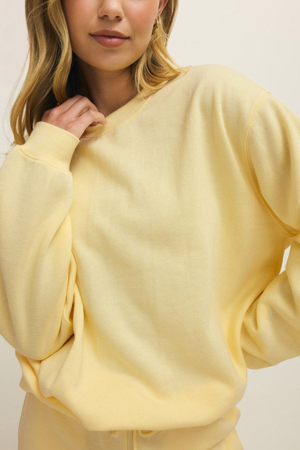 front of a woman wearing Nesna Yellow Oversized Sweatshirt from La petite garçonne 