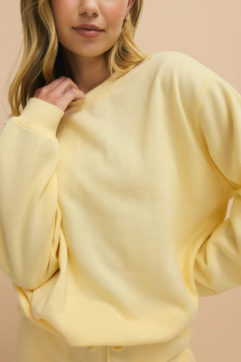 front of a woman wearing Nesna Yellow Oversized Sweatshirt from La petite garçonne 