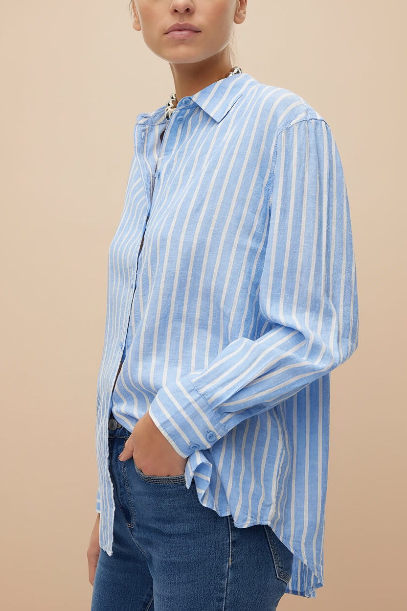 side of a woman wearing Otranto Blue Oversized Striped Blouse with Long Sleeves from La petite garçonne
