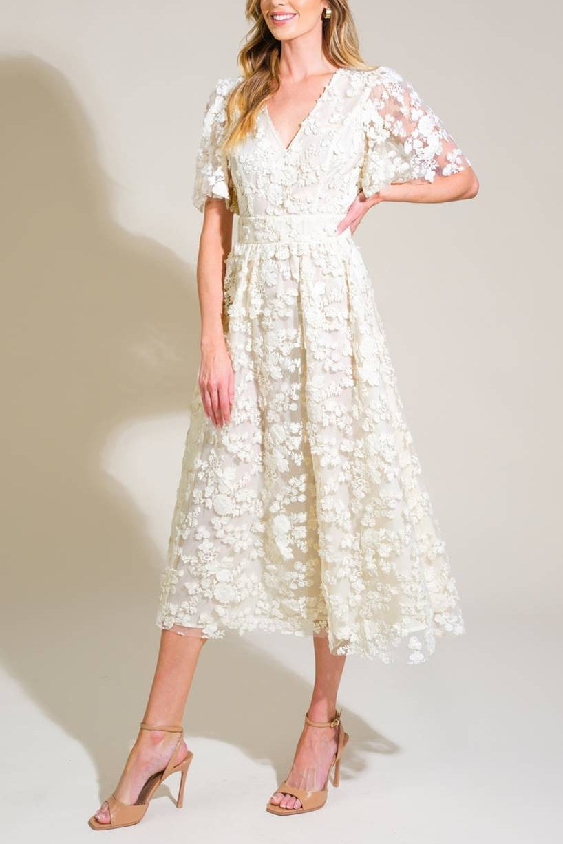 Frontview of a Woman wearing Oukie Ivory, a Midi Floral Lace Dress from Boudoir 1861