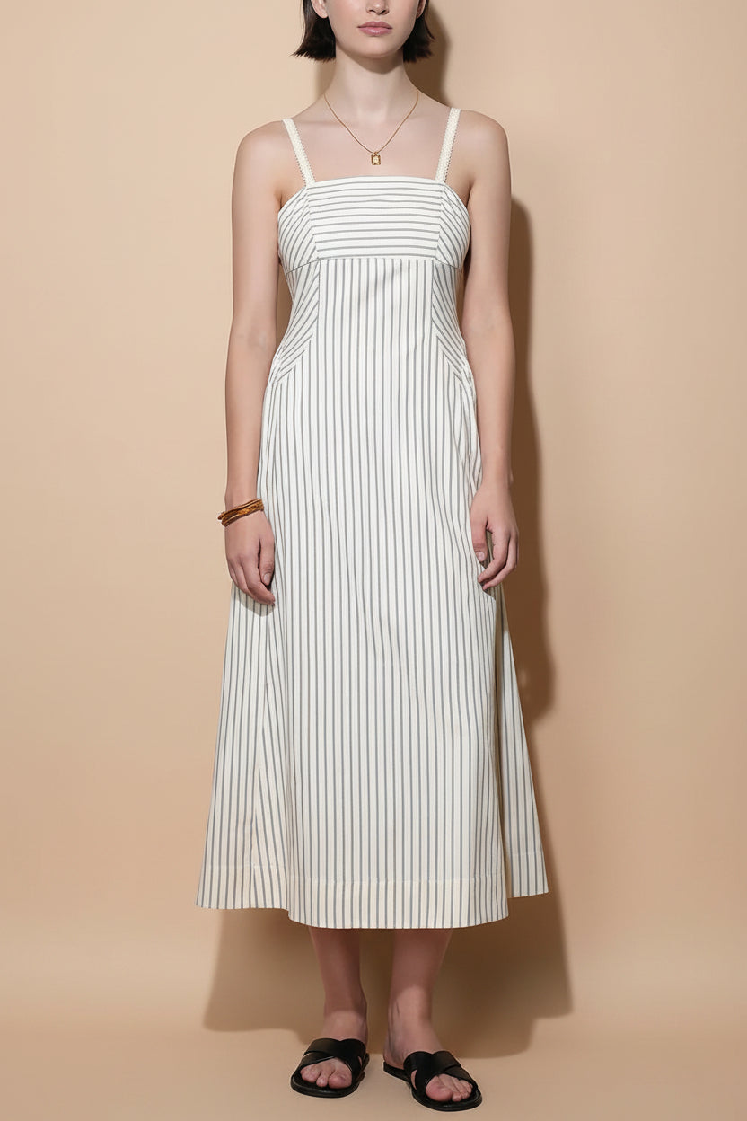 front of a woman wearing Palashi Ivory Striped Sleeveless Midi Dress with Pockets from Boutique 1861