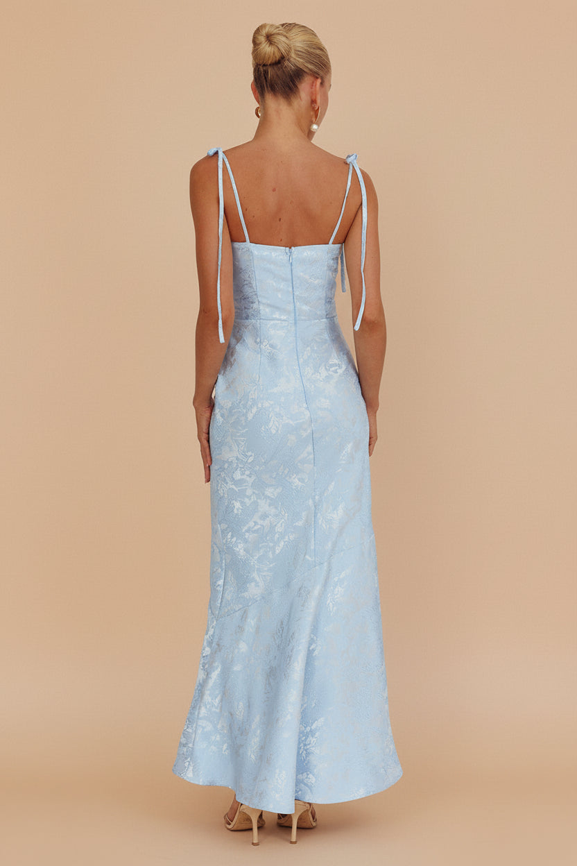 back of a woman wearing Parisia Blue Textured Maxi Mermaid Dress from Boutique 1861