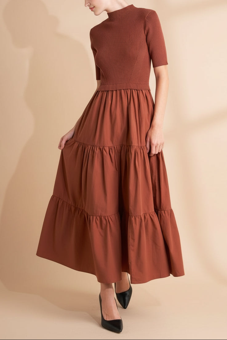 Front view of a woman wearing the Penrith Rust Mock Neck Midi Dress from boutique 1861