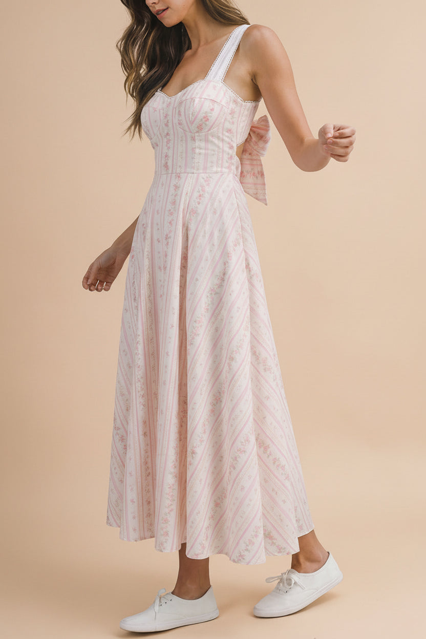 side view of a woman wearing Payse Floral Maxi Dress with Tie-Back from Boutique 1861