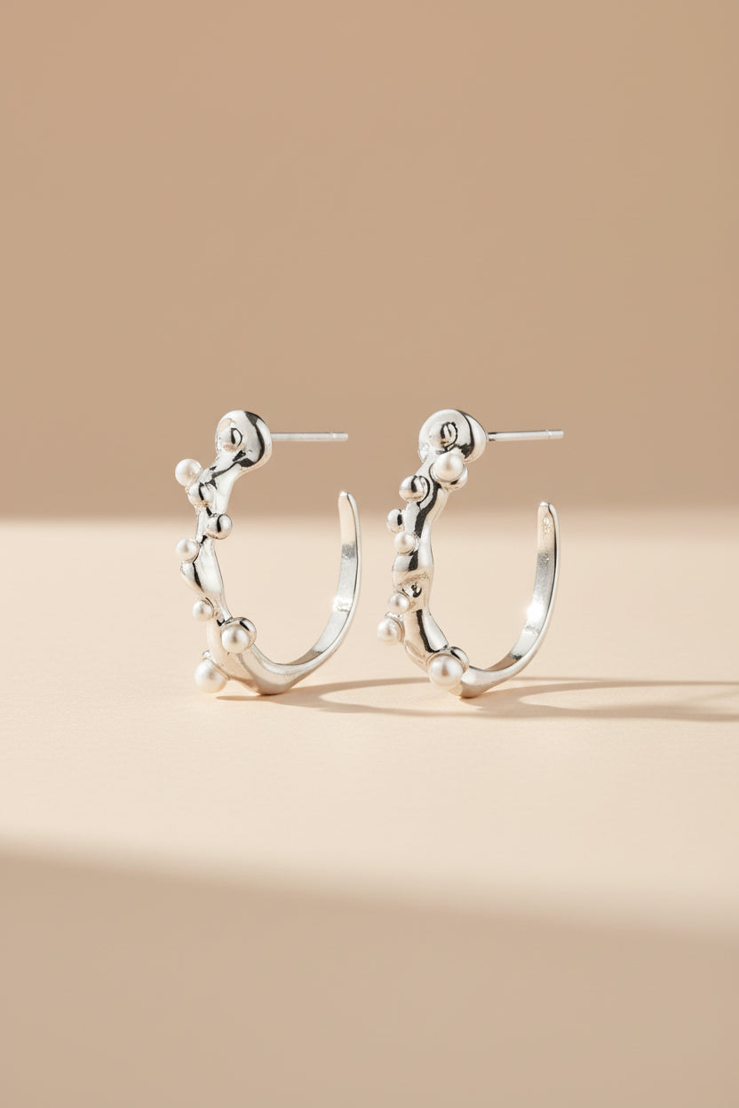 Close-up Espoo by Pilgrim, a silver earring with a clear gemstone available at la petite garçonne in Montreal