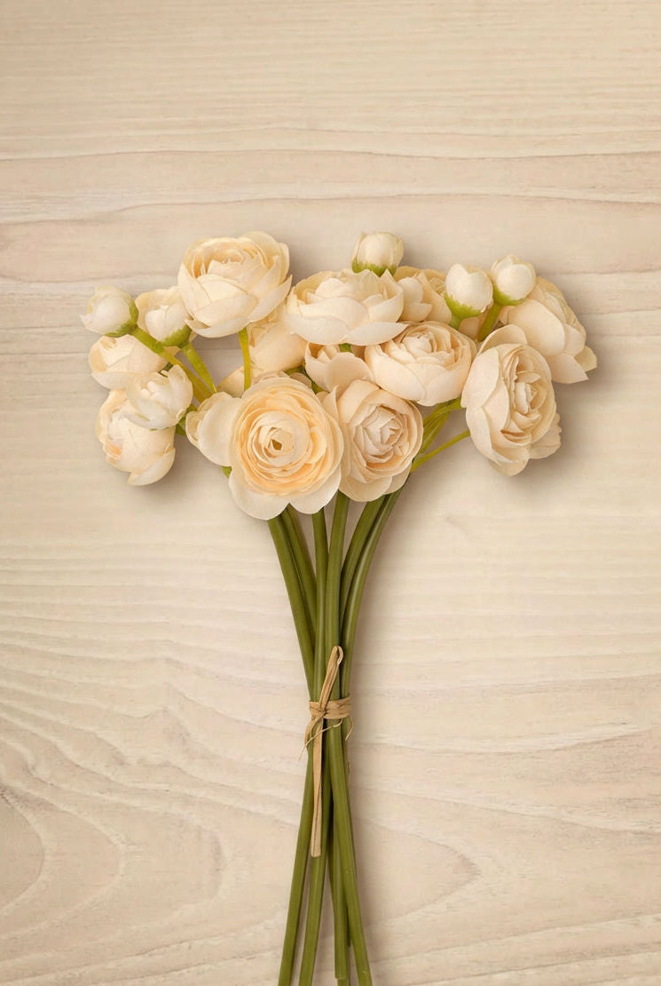 Ivory Ranunculus Bouquet flowers in a terracotta pot against a dark background