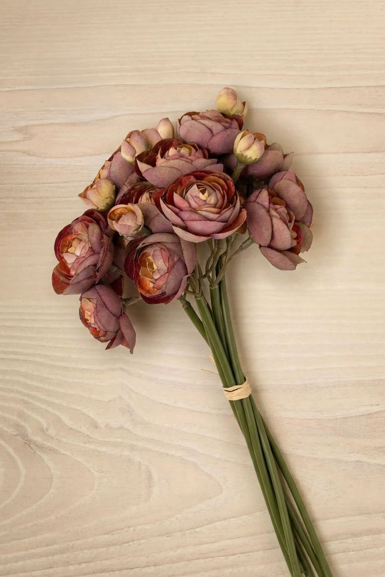 Artificial Ranunculus Bouquet flowers against a wood background