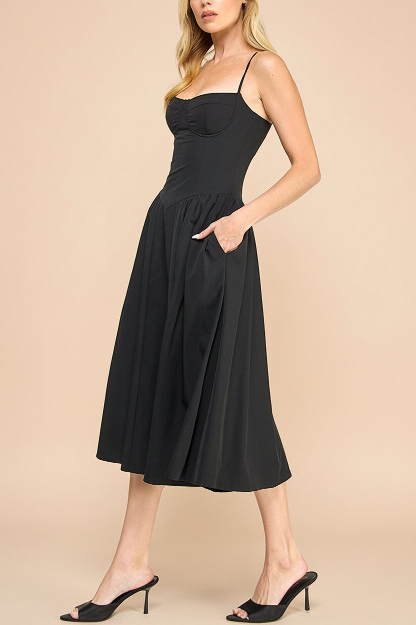 pocket view on a woman wearing Rhonda Black Bustier Midi Dress with Flared Skirt from Boutique 1861 