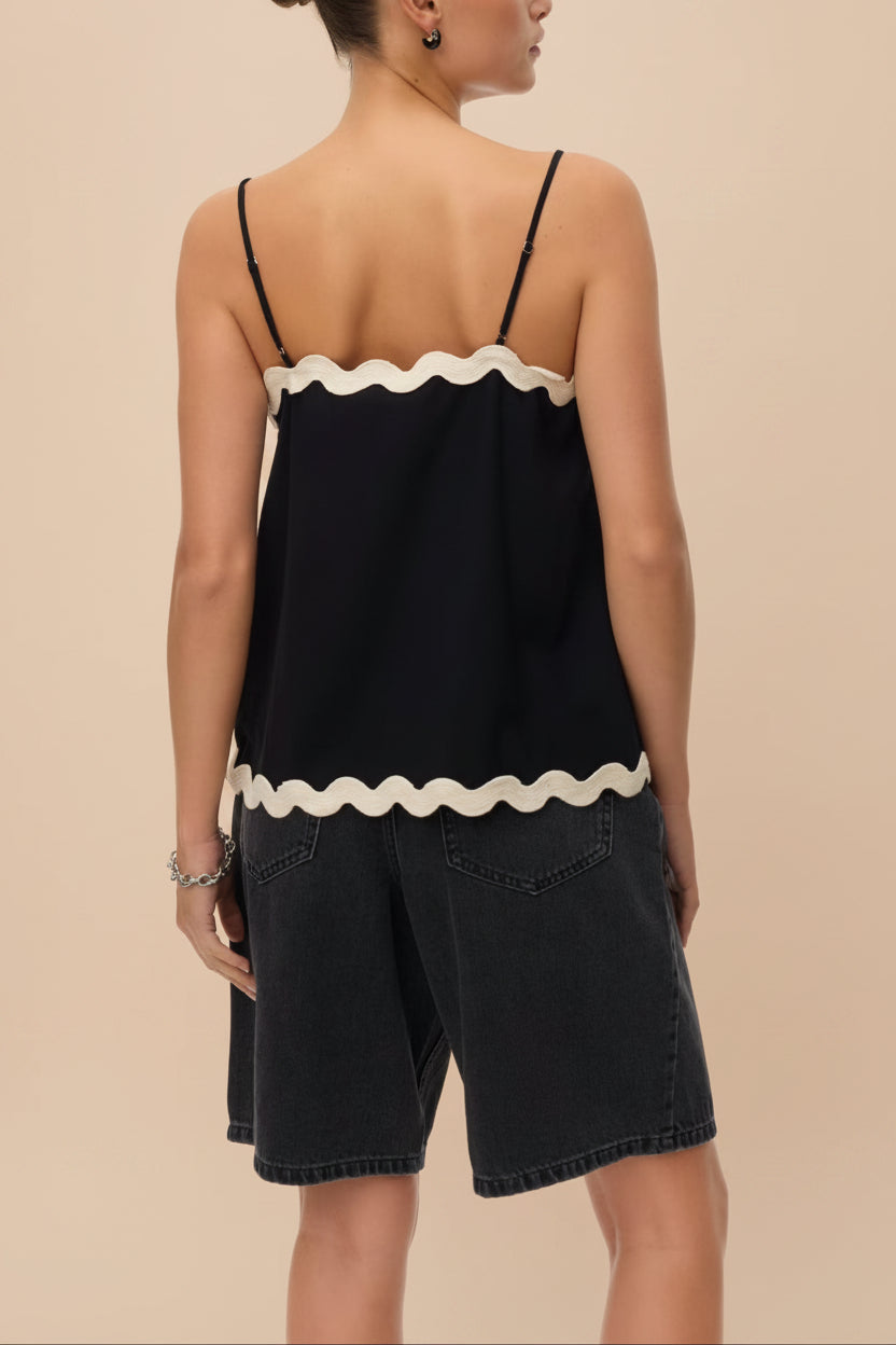 backview of a woman wearing Rieti Black Camisole with Scalloped Edges at la petite garçonne