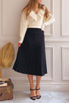 Neve Black Midi Knit Pleated Skirt | Boutique 1861 on model