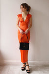 Orabelle | Fitted Orange Satin Midi Dress- Boutique 1861 on model