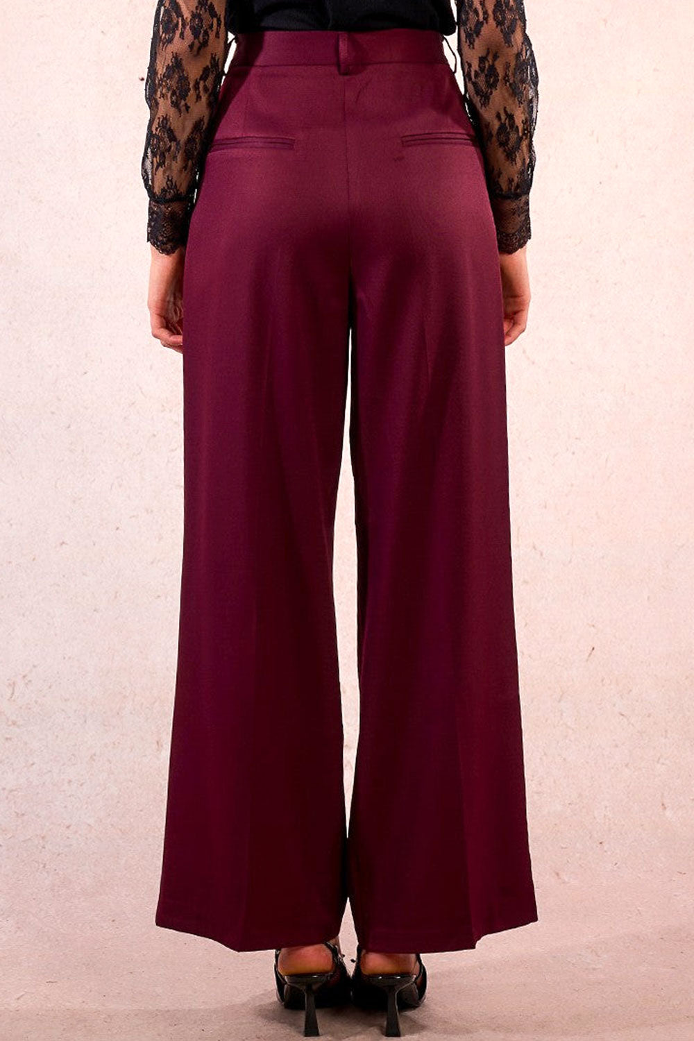 person wearing Rialto High-Waisted Pleated Burgundy Pants from La petite garçonne back