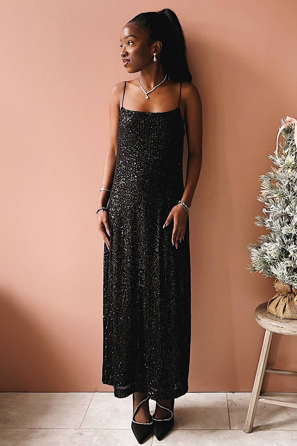 Mikaela | Black Sequin Midi Dress w/ Slit on model