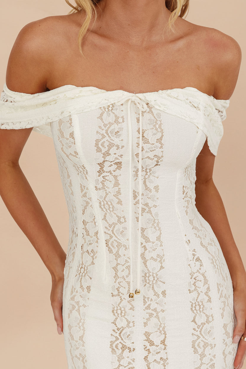 close-up of a woman wearing Sangaya Off-Shoulder Cream Lace Maxi Dress from Boudoir 1861