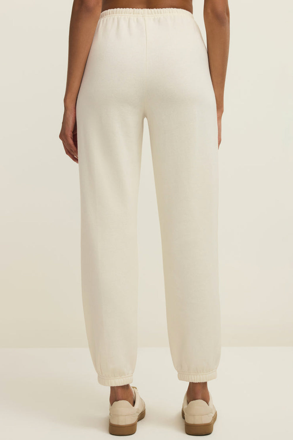 back close-up of a woman wearing Satara White Wide Leg Jogger Pants from La petite garçonne 