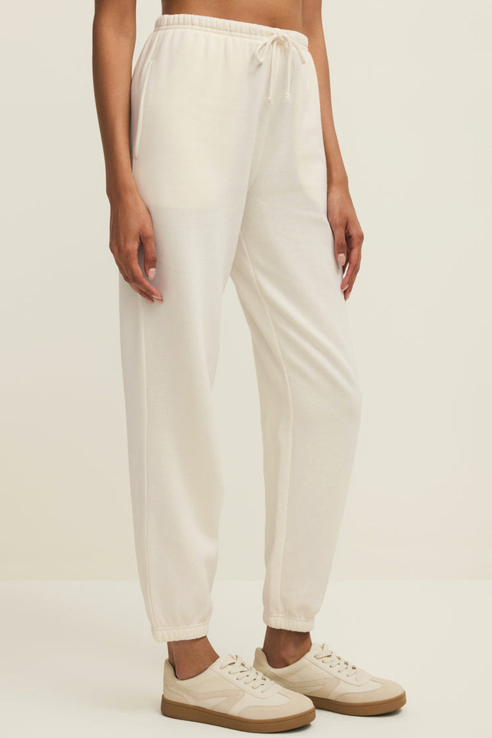 side close-up of a woman wearing Satara White Wide Leg Jogger Pants from La petite garçonne 