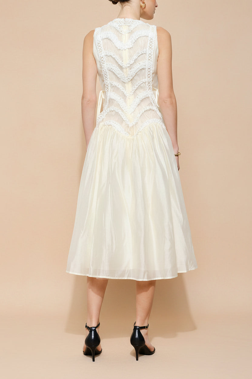 back view of a woman wearing Shania Ivory Sleeveless Midi Dress with Textured Details from Boudoir 1861